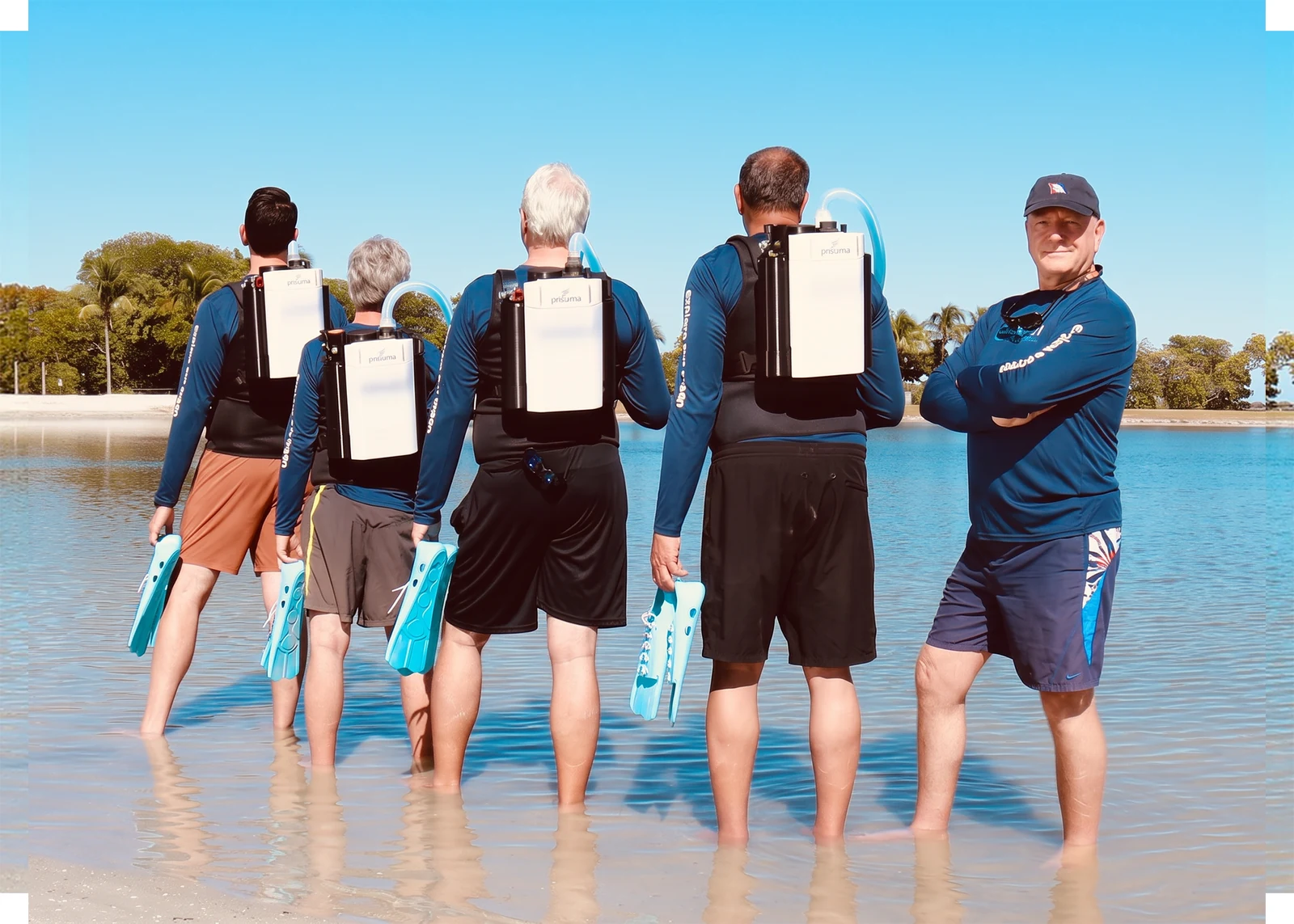 The Blue71 team walking into the water in Key Largo